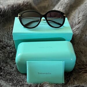 Tiffany & Co. Black Round Sunglasses with Gold Accents